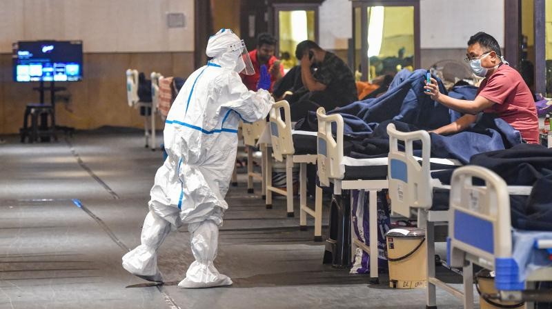 COVID-19 patients inside an isolation ward in Shehnai Banquet Hall near LNJP Hospital, in New Delhi. PTI photo